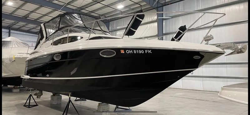 Slide: The Image of 2011 Regal 3060 Window Express boat in indoor storage facility. - 12