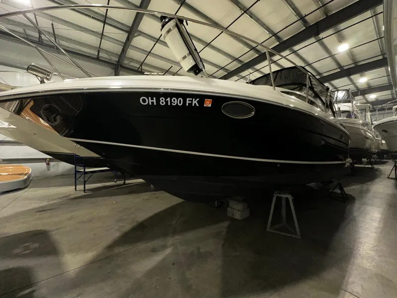 Slide: The Image of 2011 Regal 3060 Window Express boat in indoor storage facility. - 13