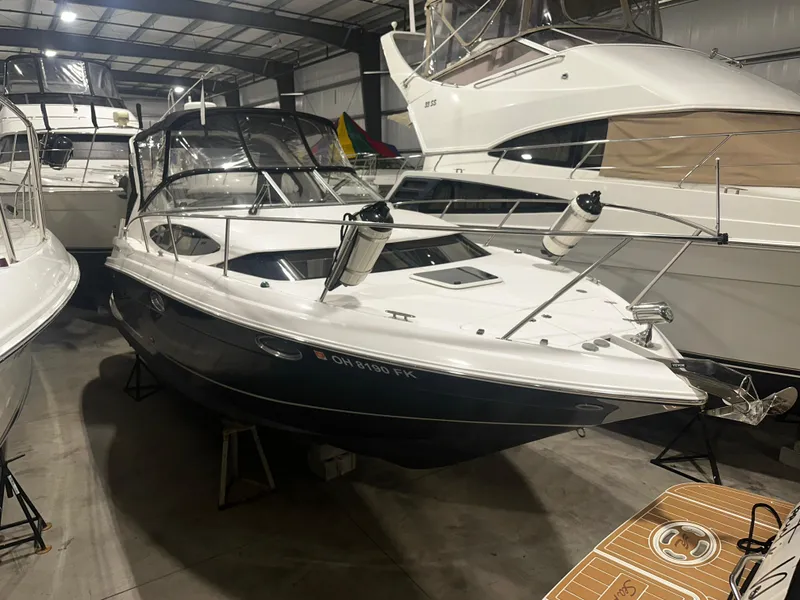 Slide: The Image of 2011 Regal 3060 Window Express boat in indoor storage facility. - 14