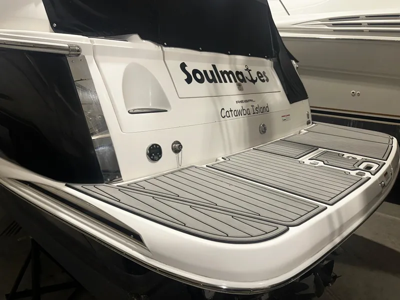 Slide: The Image of 2011 Regal 3060 Window Express boat, rear view, docked at Catawba Island. - 15