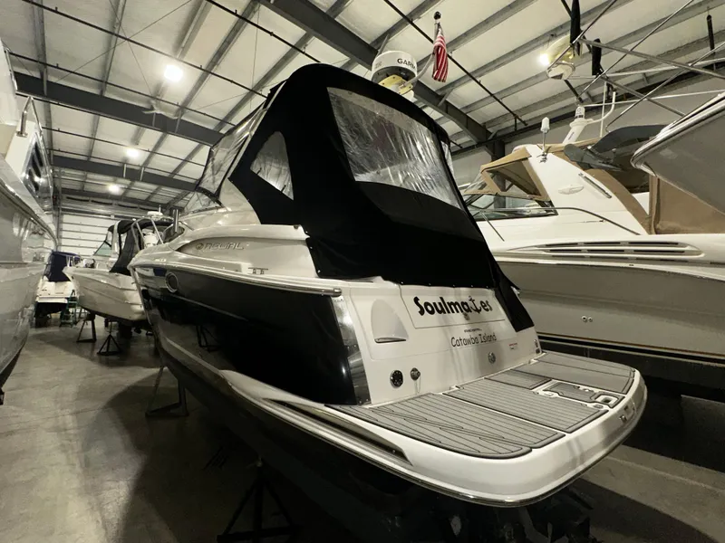 Slide: The Image of 2011 Regal 3060 Window Express boat in indoor storage facility. - 16