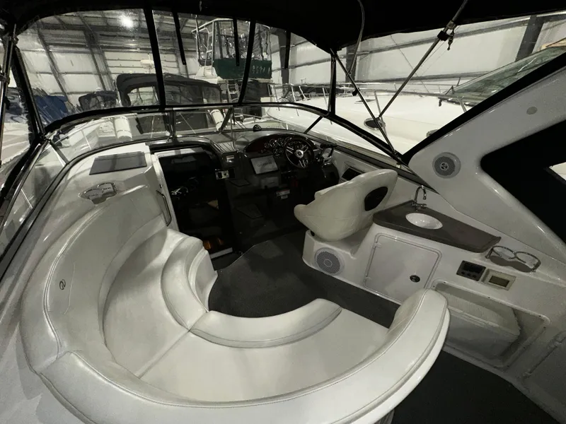 Slide: The Image of 2011 Regal 3060 Window Express boat interior with seating and helm. - 17