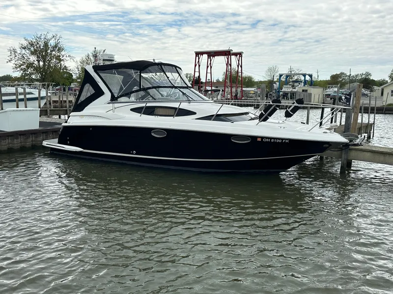 Slide: The Image of 2011 Regal 3060 Window Express boat docked in marina. - 2