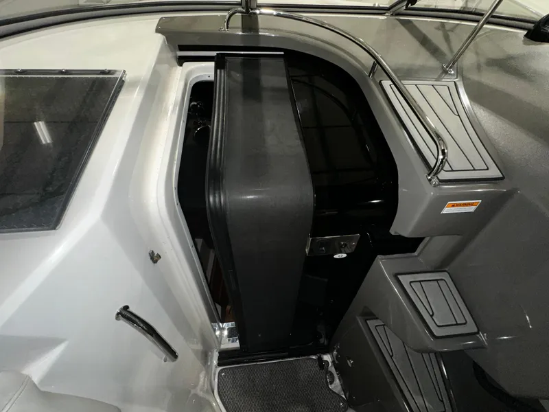 Slide: The Image of 2011 Regal 3060 Window Express cabin entrance with sleek design and modern features. - 26