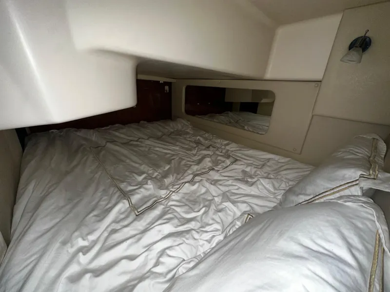 Slide: The Image of Cozy cabin bed in 2011 Regal 3060 Window Express yacht interior. - 32