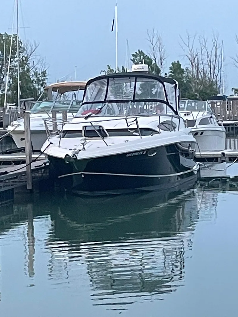 Slide: The Image of 2011 Regal 3060 Window Express boat docked in a marina. - 5