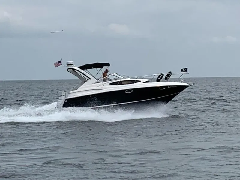 Slide: The Image of 2011 Regal 3060 Window Express cruising on open water. - 6