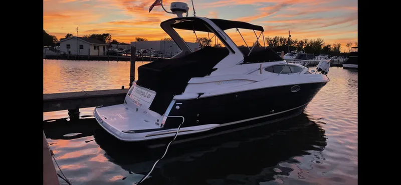 Slide: The Image of 2011 Regal 3060 Window Express boat docked at sunset. - 7