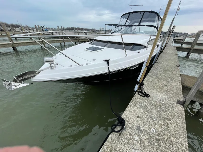 Slide: The Image of 2011 Regal 3060 Window Express boat docked in a marina. - 8