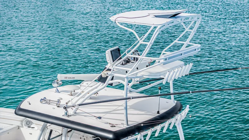 Slide: The Image of 2016 Stamas 390 Tarpon boat with fishing rods on turquoise water. - 18