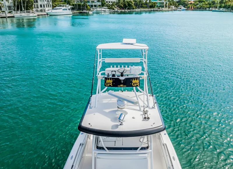 Slide: The Image of 2016 Stamas 390 Tarpon boat on clear turquoise water, surrounded by yachts. - 21