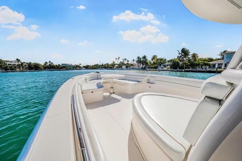 Slide: The Image of 2016 Stamas 390 Tarpon boat on serene water with clear blue sky. - 25