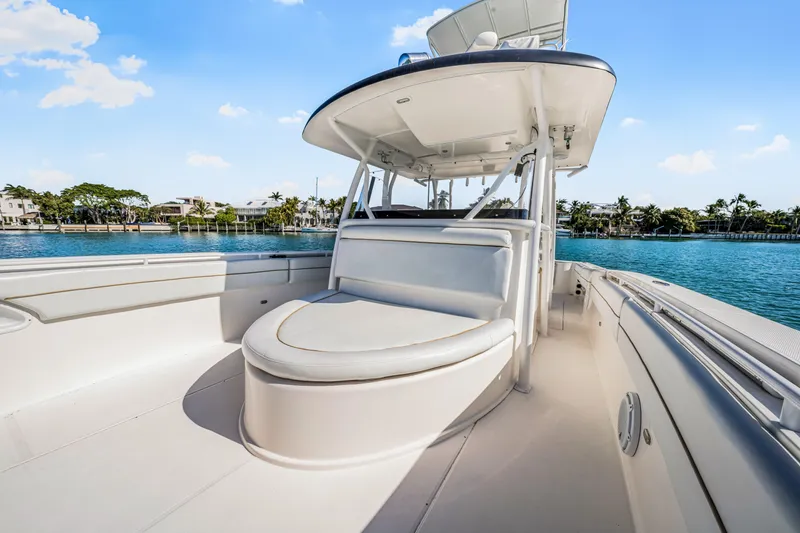 Slide: The Image of 2016 Stamas 390 Tarpon boat with sleek seating, on a sunny day by the water. - 26