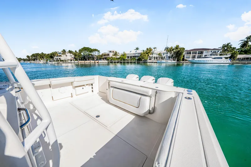 Slide: The Image of 2016 Stamas 390 Tarpon boat on clear blue water, luxury waterfront homes in background. - 29