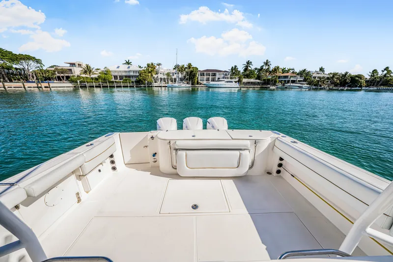 Slide: The Image of 2016 Stamas 390 Tarpon boat deck overlooking serene waterfront homes. - 31