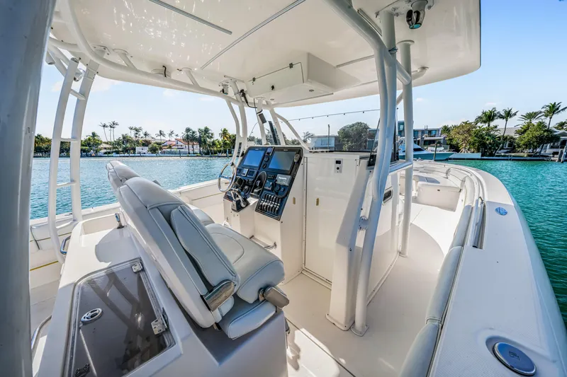Slide: The Image of 2016 Stamas 390 Tarpon boat interior with helm, seats, and ocean view. - 32