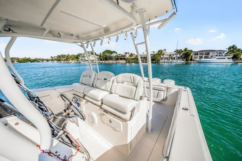 Slide: The Image of 2016 Stamas 390 Tarpon boat interior with seating, on a sunny day by the water. - 35