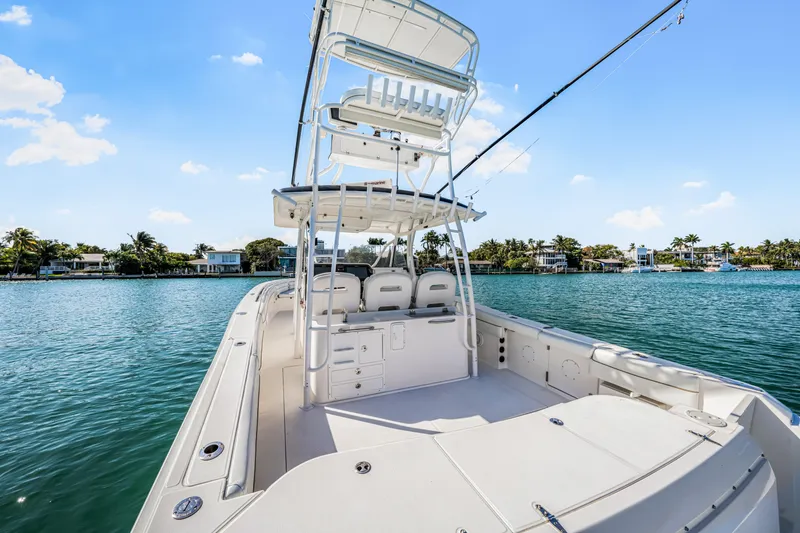 Slide: The Image of 2016 Stamas 390 Tarpon boat on calm water, clear sky background. - 39