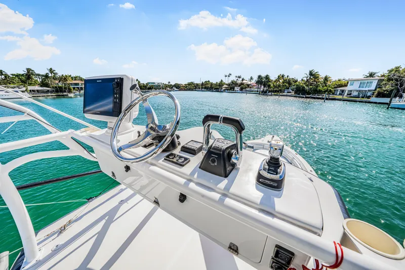 Slide: The Image of 2016 Stamas 390 Tarpon boat helm with controls and scenic water view. - 40