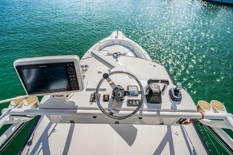 Slide: The Image of 2016 Stamas 390 Tarpon boat helm with steering wheel and navigation system. - 42