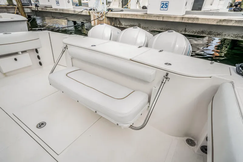 Slide: The Image of 2016 Stamas 390 Tarpon boat interior with white seating and outboard motors. - 43