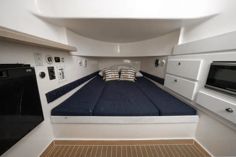 Slide: The Image of Interior cabin of 2016 Stamas 390 Tarpon boat with bed, storage, and appliances. - 47