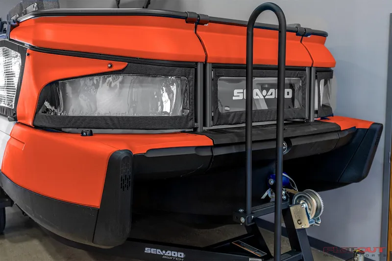 Slide: The Image of 2024 Sea-Doo SWITCH Cruise 21, orange exterior, on trailer, front view. Save $12,000. - 3