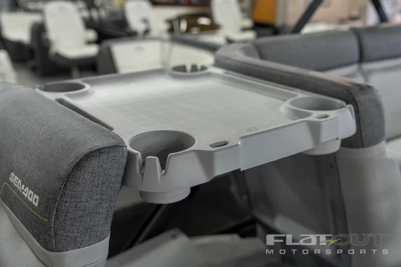 Slide: The Image of 2024 Sea-Doo SWITCH Cruise 21 interior with cup holders and seating. - 20