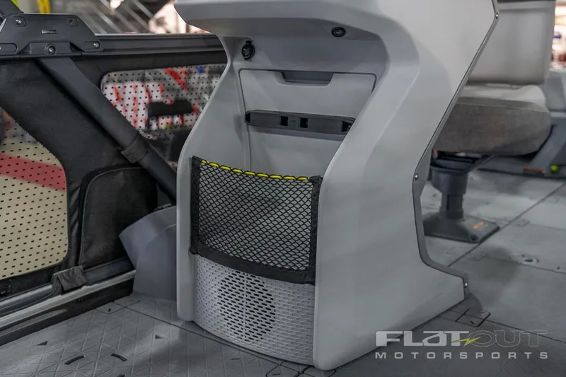 Slide: The Image of 2024 Sea-Doo SWITCH Cruise 21 interior storage compartment with mesh netting. - 29