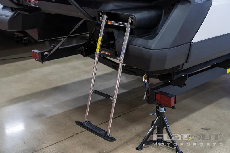 Slide: The Image of 2024 Sea-Doo SWITCH Cruise 21 with ladder, showcasing rear design and trailer support. - 30