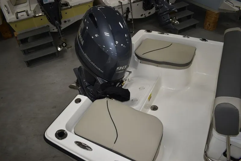 Slide: The Image of 2025 Key West 1720 CC boat with Yamaha 90 outboard motor, featuring cushioned seating. - 11