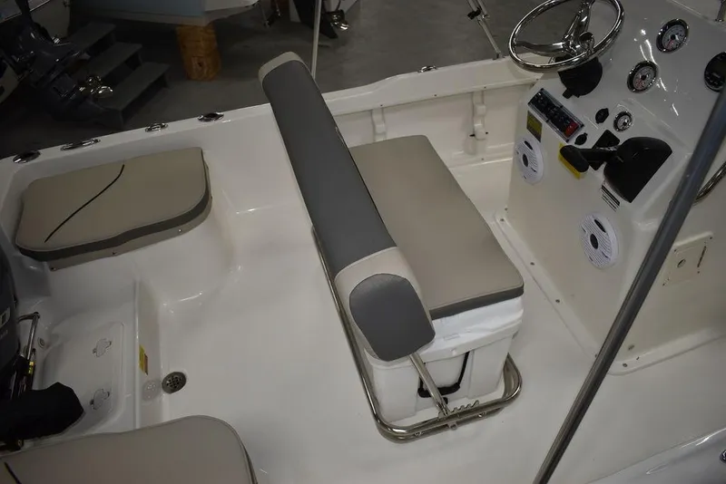 Slide: The Image of 2025 Key West 1720 CC boat interior with seating and control panel. - 12