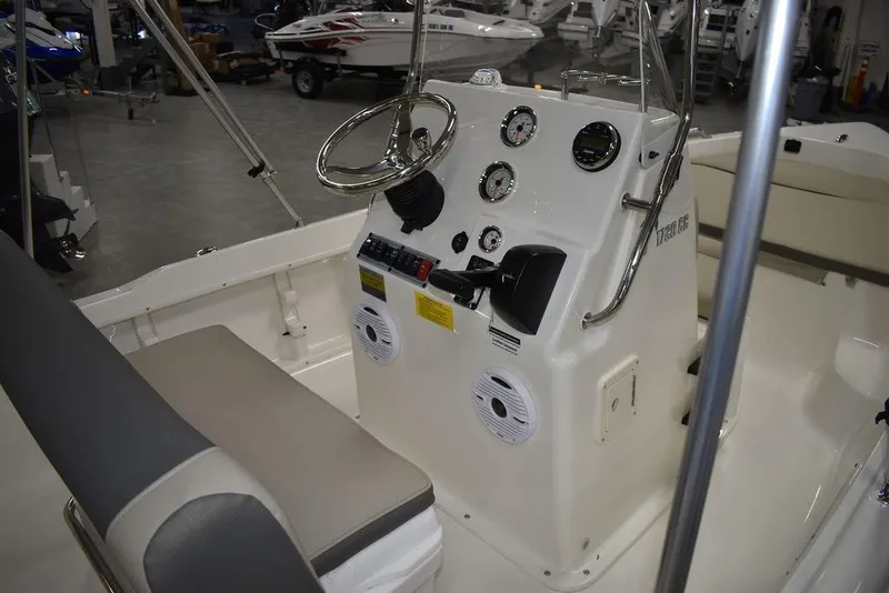 Slide: The Image of 2025 Key West 1720 CC boat interior with steering console and seating. - 13