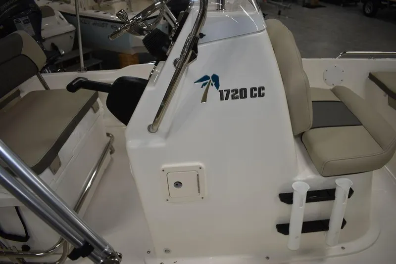 Slide: The Image of 2025 Key West 1720 CC boat interior with steering console and seating. - 14