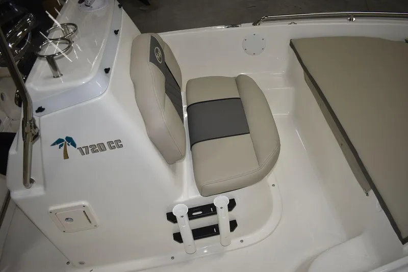 Slide: The Image of 2025 Key West 1720 CC boat interior with beige seating and console. - 18