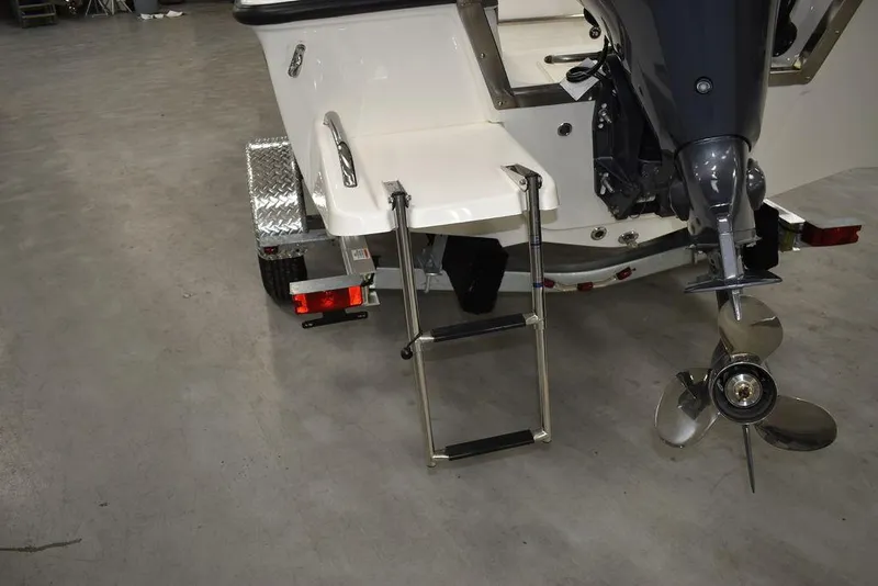 Slide: The Image of 2025 Key West 1720 CC boat with ladder and motor on trailer. - 21