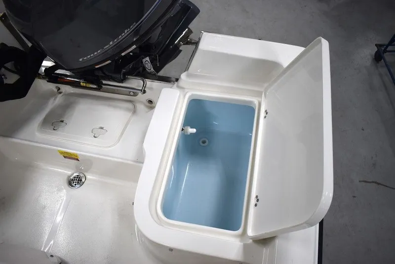 Slide: The Image of 2025 Key West 1720 CC boat with open storage compartment. - 27