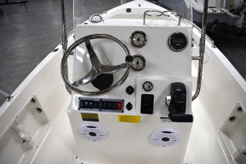Slide: The Image of 2025 Key West 1720 CC boat console with steering wheel and gauges. - 31
