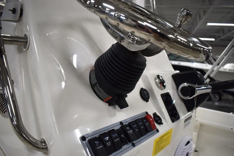Slide: The Image of Close-up of 2025 Key West 1720 CC boat dashboard with steering wheel and controls. - 32