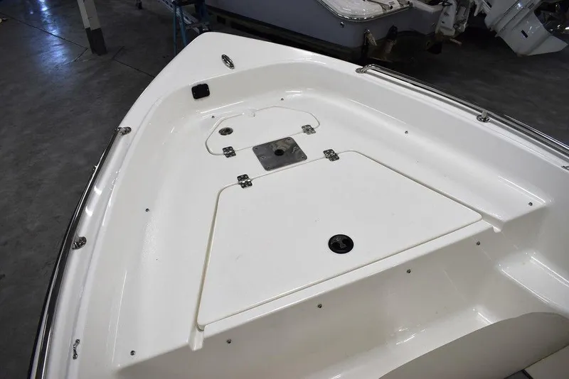 Slide: The Image of 2025 Key West 1720 CC boat deck, white finish, spacious storage compartment. - 39