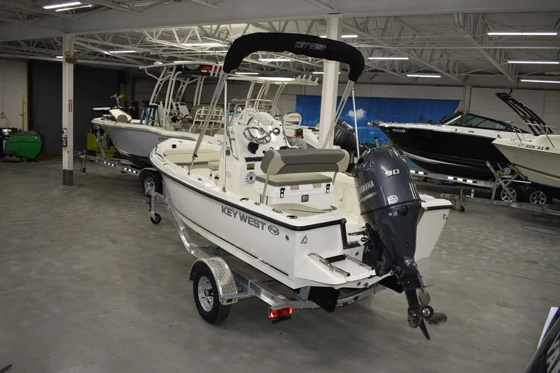 Slide: The Image of 2025 Key West 1720 CC boat in showroom, featuring Yamaha outboard motor. - 4