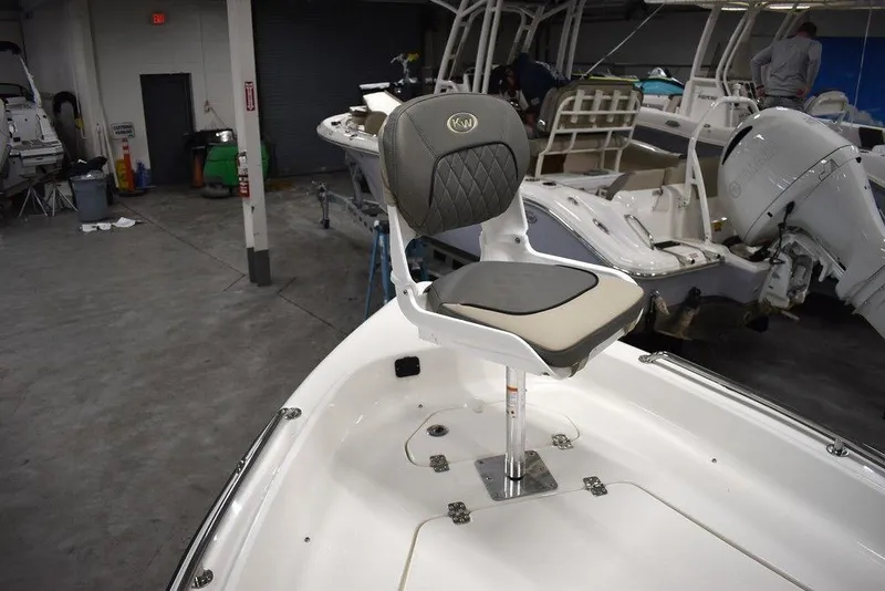 Slide: The Image of 2025 Key West 1720 CC boat interior with swivel seat in a showroom. - 43