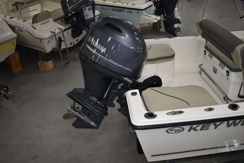 Slide: The Image of 2025 Key West 1720 CC boat with Yamaha outboard motor in showroom. - 9