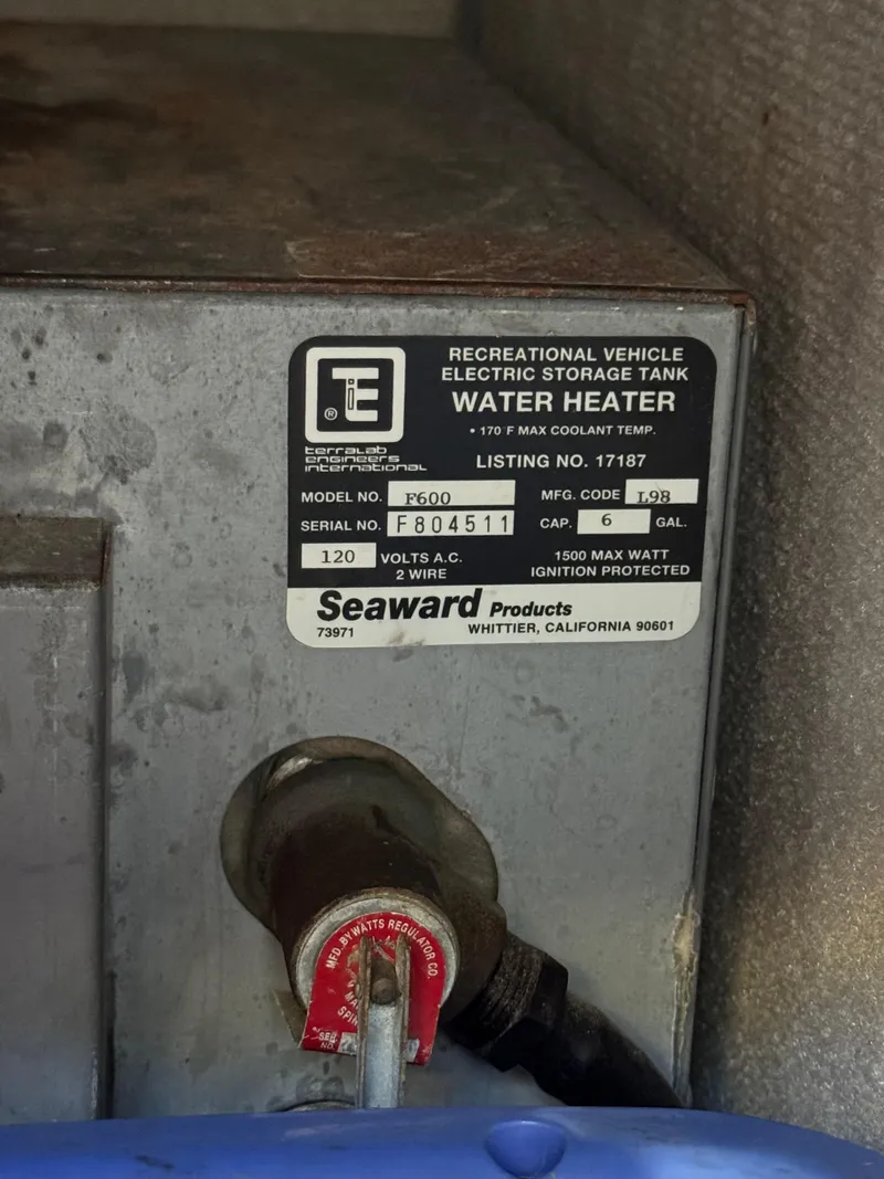 Slide: The Image of 1999 Osprey 26 Legend RV water heater label, Seaward model F600, 6-gallon capacity. - 7
