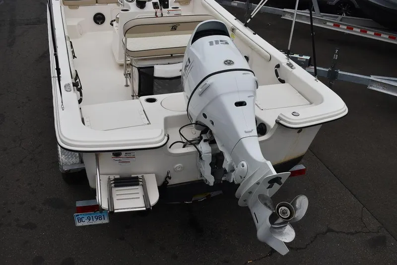Slide: The Image of 2022 Carolina Skiff 19 LS boat with outboard motor, rear view. - 10