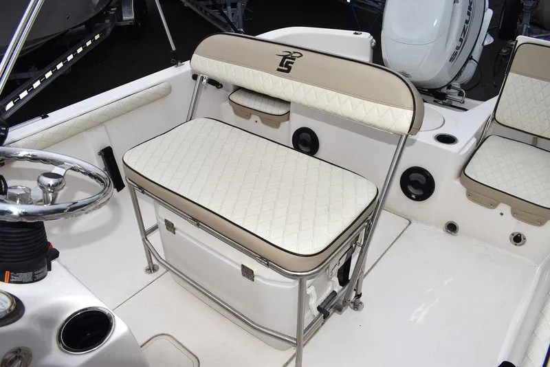 Slide: The Image of 2022 Carolina Skiff 19 LS boat interior with cushioned seating and storage. - 20
