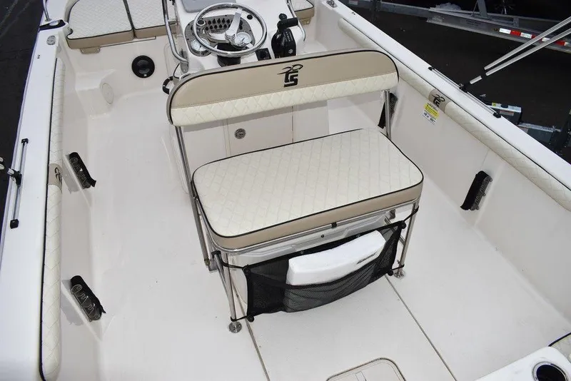 Slide: The Image of 2022 Carolina Skiff 19 LS boat interior with steering console and cushioned seating. - 21