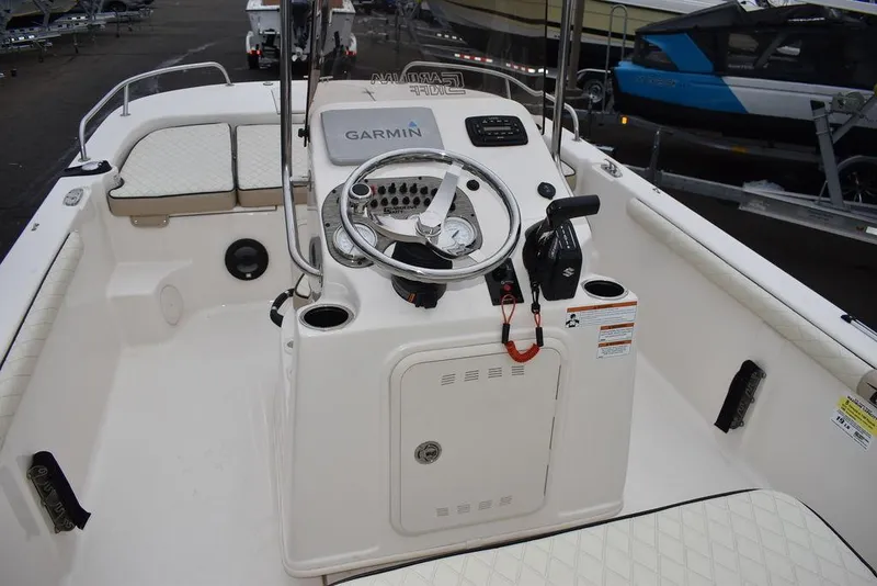 Slide: The Image of 2022 Carolina Skiff 19 LS boat interior with Garmin navigation system. - 24