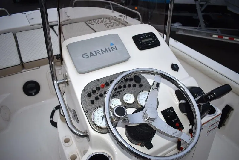 Slide: The Image of 2022 Carolina Skiff 19 LS boat dashboard with Garmin navigation system. - 26