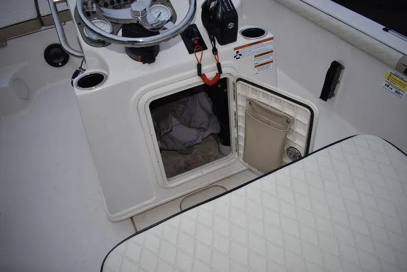 Slide: The Image of 2022 Carolina Skiff 19 LS boat console with open storage compartment. - 31